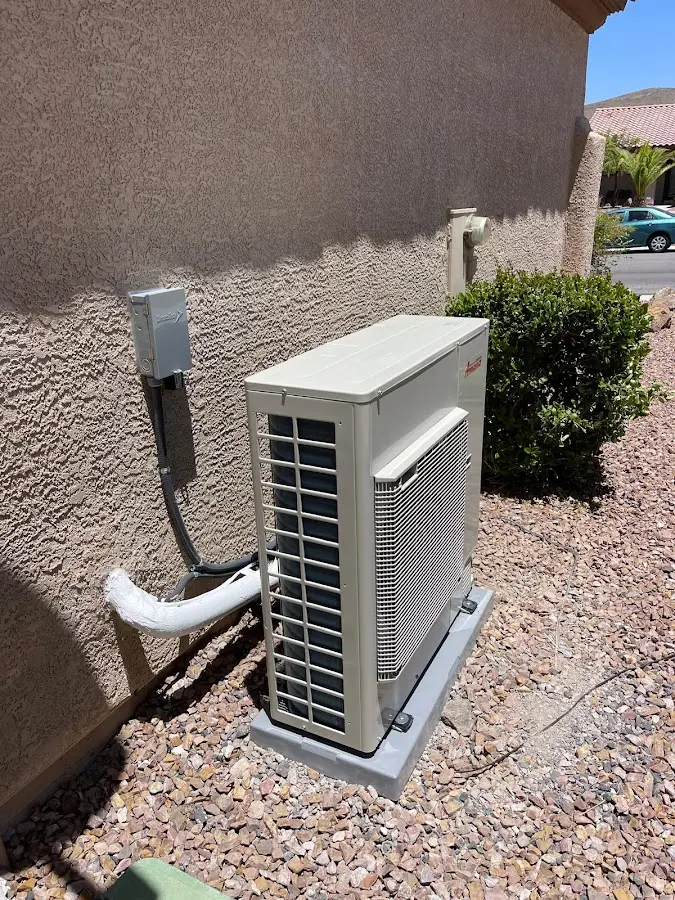 Residential air conditioning condenser unit in Linton